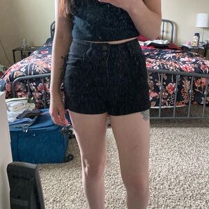 A pair of black shorts